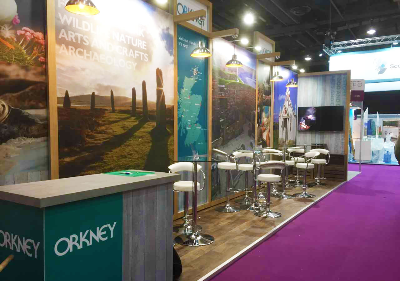 destination Orkney stand at visit scotland expo 2019 decorated with images of iconic orkney sites 